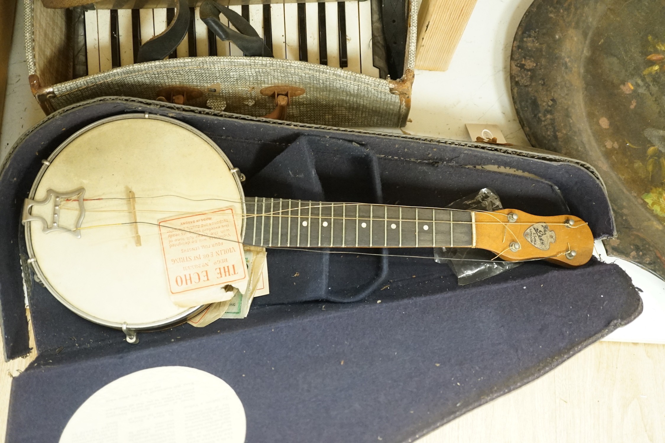 Grey and Sons banjo and a Bell accordian, both cased